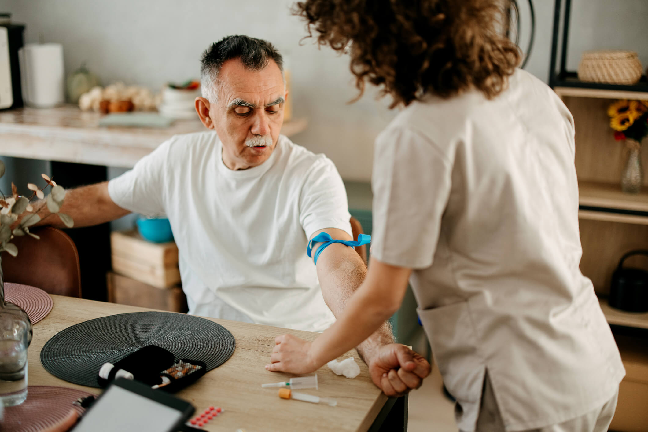 Phlebotomist collects blood